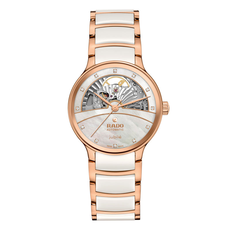 Roségoldene Uhr mit weißem Band und skelettiertem Zifferblatt, edel wirkend